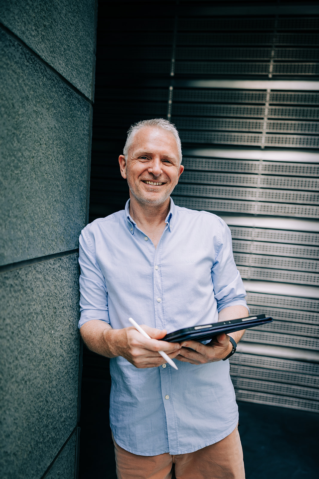 Danny Young holding a tablet